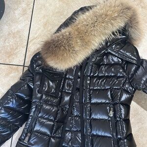 Women’s black puffer coat with fur hood